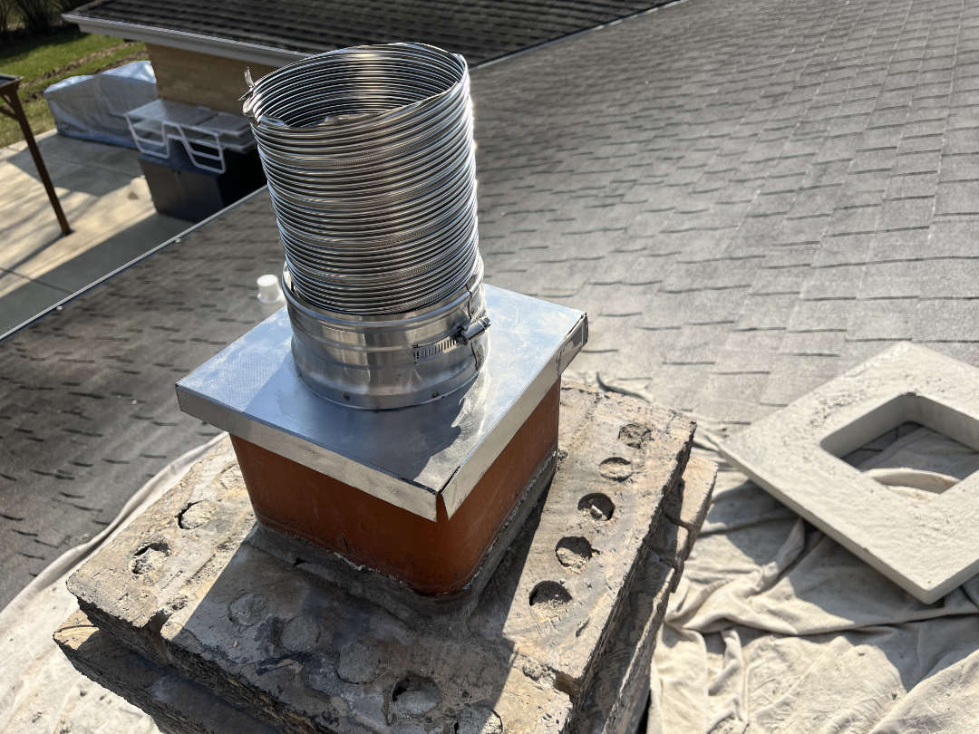 New stainless steel chimney liners install installed Chimney liner during installation