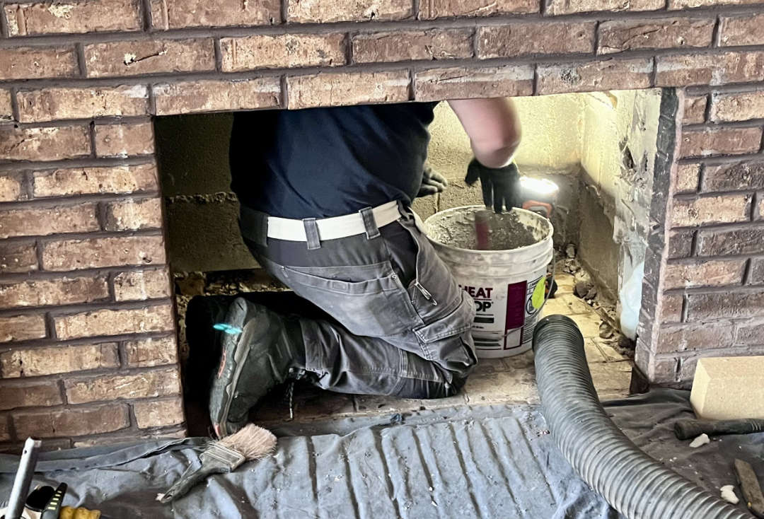 Working in a fireplace Fireplace Repair