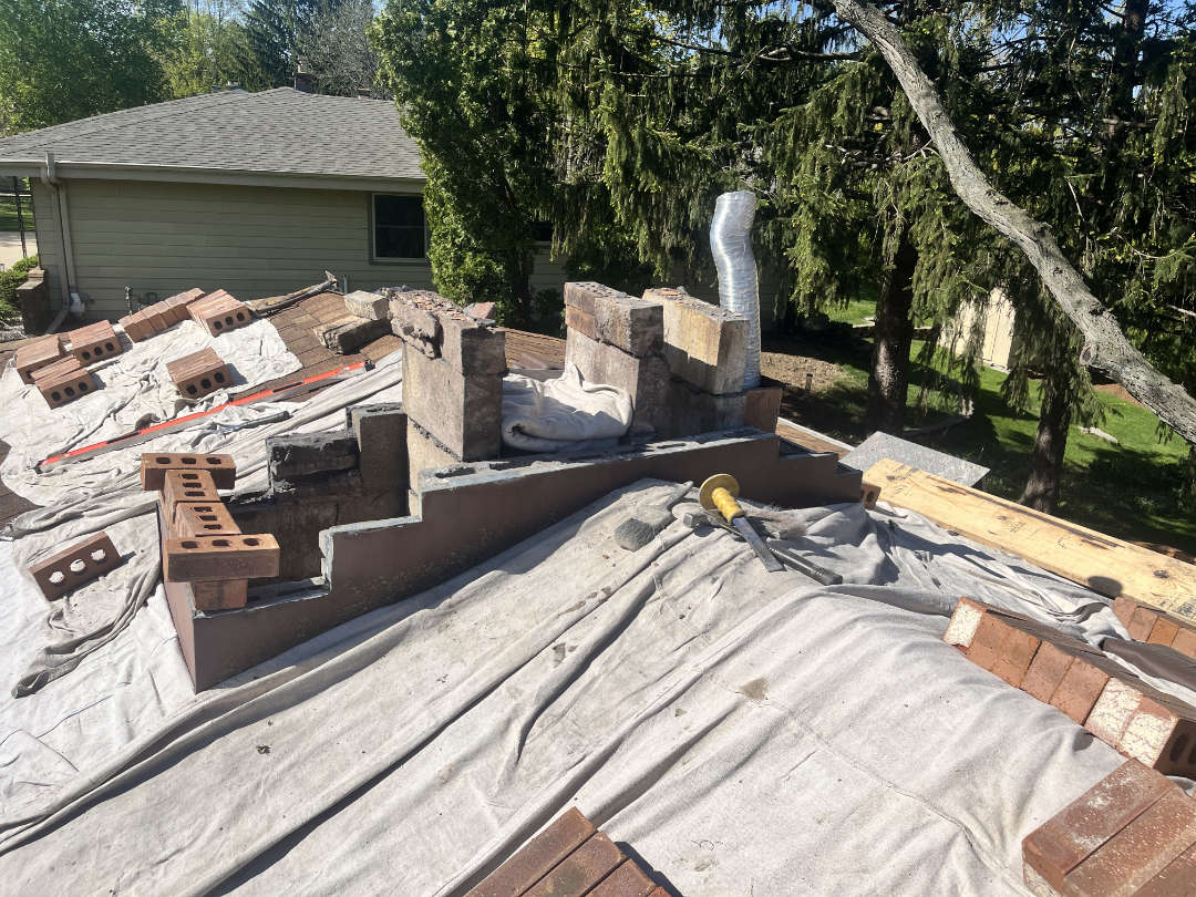Chimney during rebuild Chimney torn down
